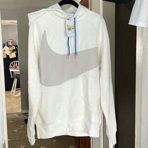 Niky white cream with a gray checkmark showing the registered mark on back